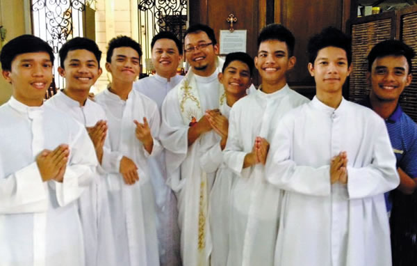 Fr. Kurt Zion Pala with altar servers