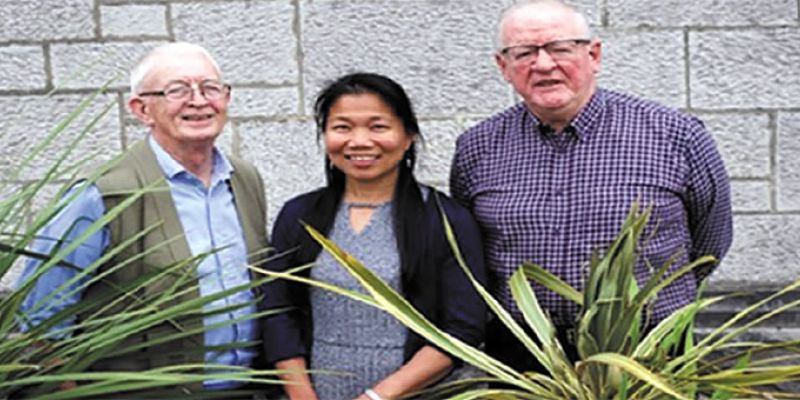 Angie with Fr. Berne Steed (left) and Fr. Oli McCrossan (right)