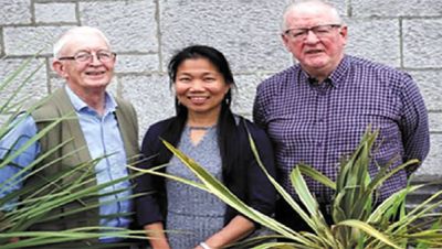 Angie with Fr. Berne Steed (left) and Fr. Oli McCrossan (right)